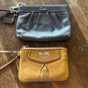 Two leather coach wristlets
